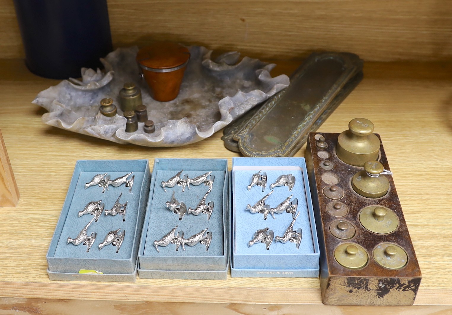 A weight set, a Danish leather bound cup measurement set marked ‘Ria Denmark, three sets of bird menu holders, and other items